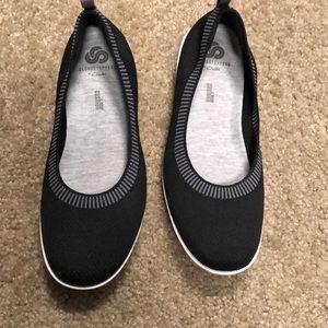 Black shoes. White soles, cushion inserts